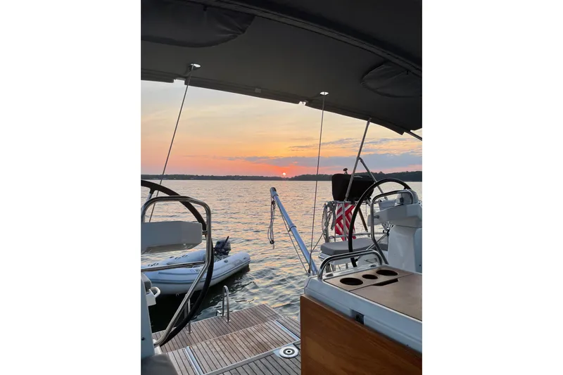 Recovery Room Yacht Photos Pics Jeanneau 51 sailboat at sunset, 2019 model, with scenic ocean view.