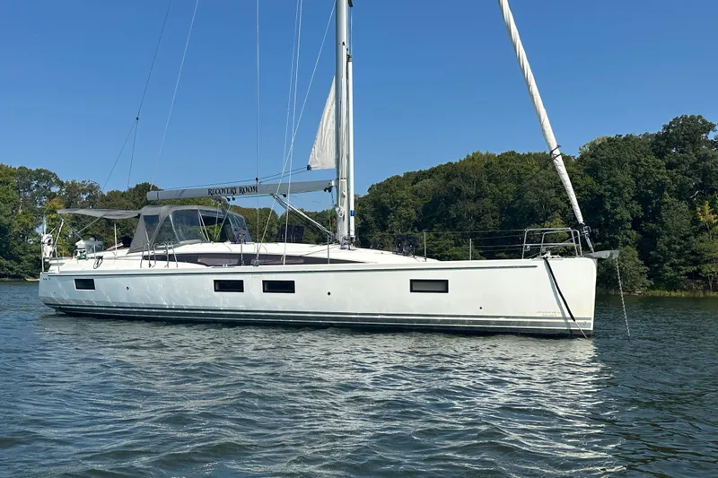 Recovery Room Yacht Photos Pics 2019 Jeanneau 51 sailboat on calm water.