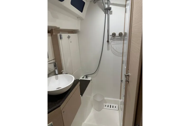 Recovery Room Yacht Photos Pics Modern bathroom in 2019 Jeanneau 51 yacht with shower and sink.