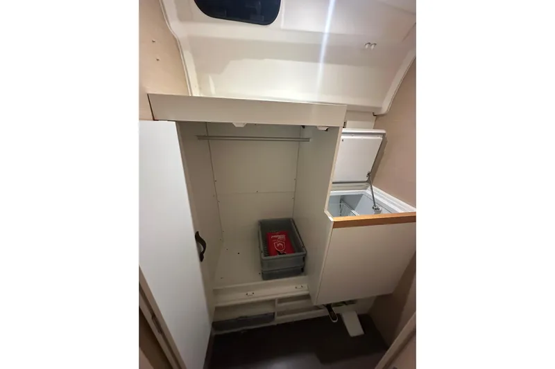 Recovery Room Yacht Photos Pics Interior storage space of 2019 Jeanneau 51 yacht with open compartments.