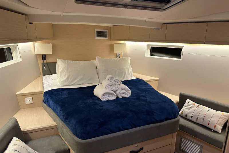 Recovery Room Yacht Photos Pics Luxurious cabin interior of 2019 Jeanneau 51 yacht with cozy bedding and modern design.