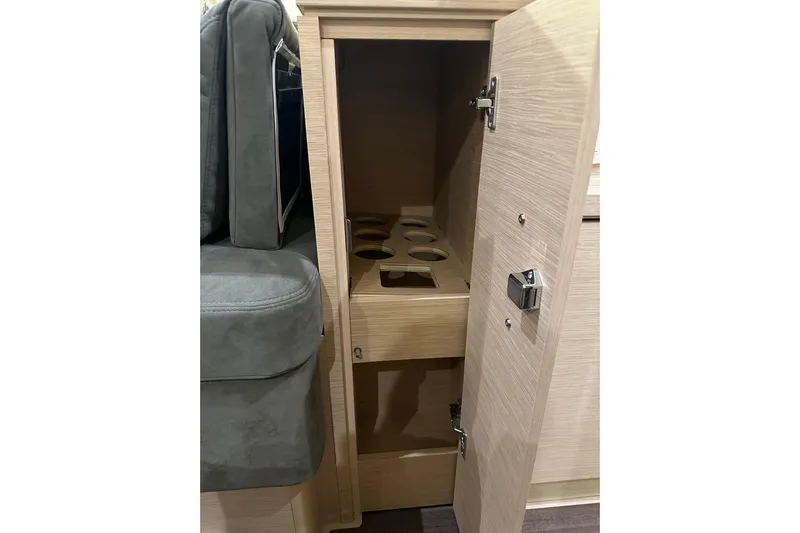 Recovery Room Yacht Photos Pics 2019 Jeanneau 51 interior cabinet with wine bottle storage.