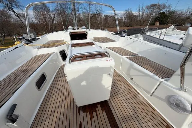 Recovery Room Yacht Photos Pics 2019 Jeanneau 51 yacht deck with sleek wood finish and spacious seating.