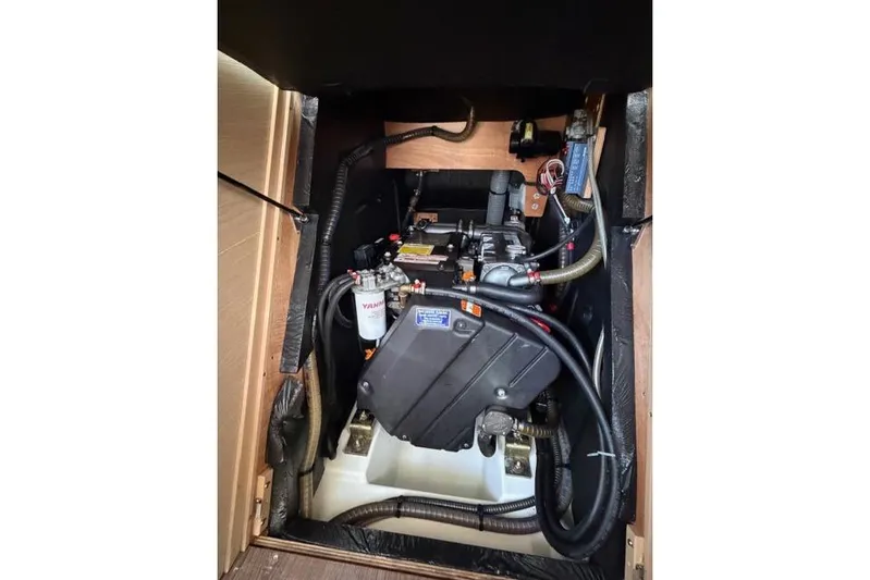 Recovery Room Yacht Photos Pics Engine compartment of a 2019 Jeanneau 51 sailboat, featuring a Yanmar engine.