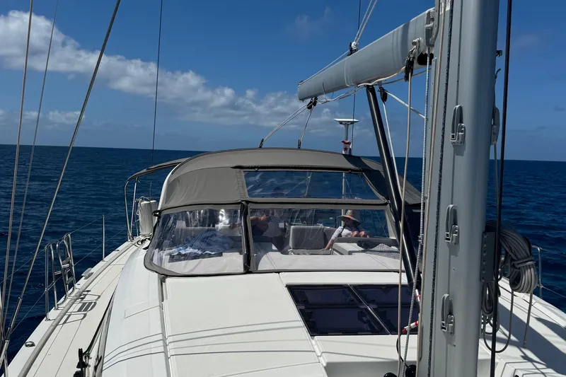 Miss Fiona Yacht Photos Pics 2020 Jeanneau 64 yacht sailing on open sea under clear blue sky.