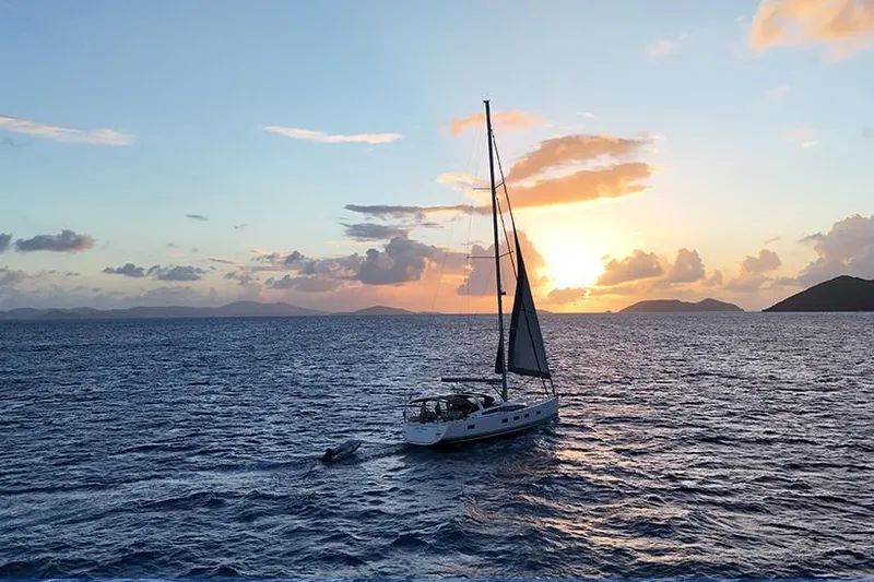 Miss Fiona Yacht Photos Pics Sailing yacht Jeanneau 64 (2020) at sunset on open sea.