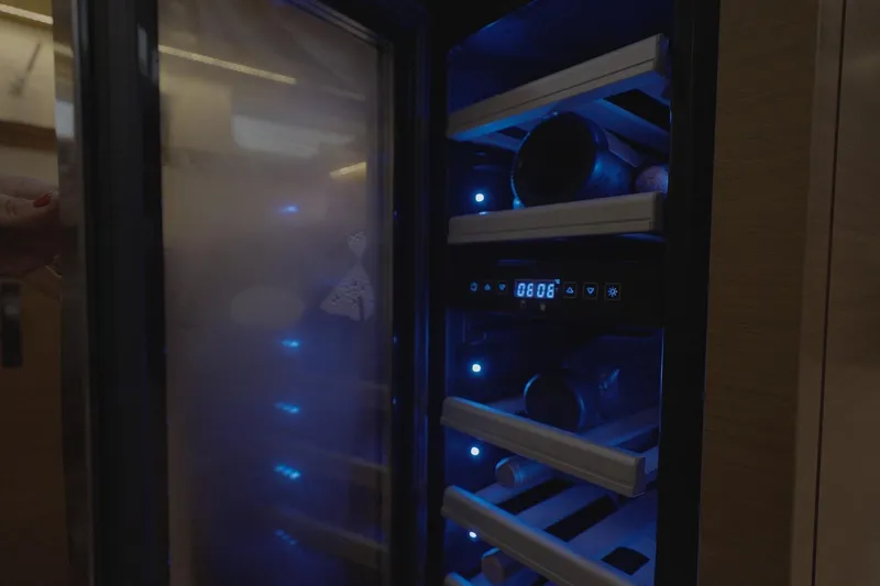 Miss Fiona Yacht Photos Pics Wine cooler with blue LED lights inside Jeanneau 64 yacht, 2020 model.