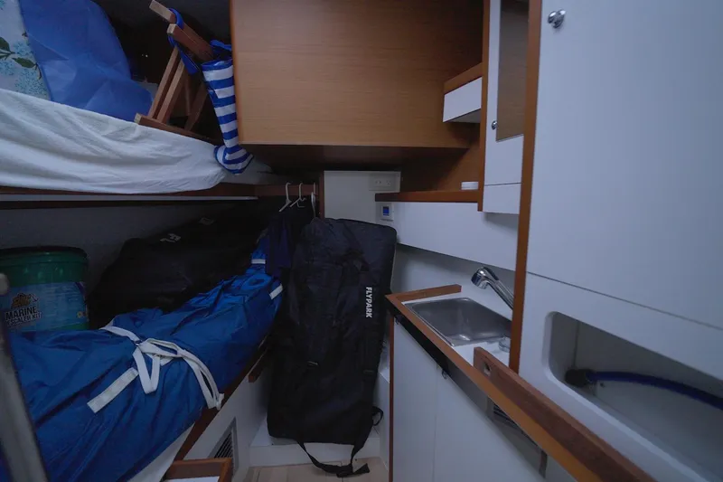 Miss Fiona Yacht Photos Pics Interior of 2020 Jeanneau 64 yacht cabin with storage and sink area.