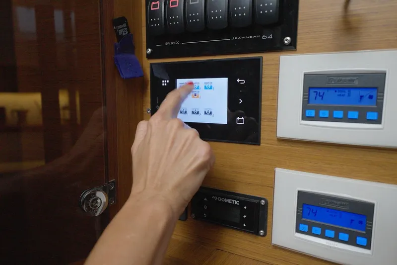 Miss Fiona Yacht Photos Pics Touchscreen control panel on a 2020 Jeanneau 64 yacht with digital displays.