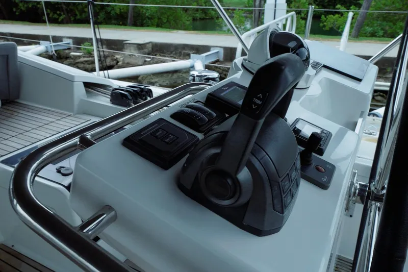 Miss Fiona Yacht Photos Pics Cockpit controls of a 2020 Jeanneau 64 yacht, featuring modern navigation equipment.