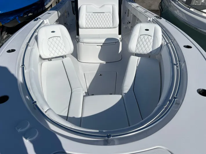  Yacht Photos Pics 2025 Sportsman Open 262 Center Console boat with white cushioned seating and sleek design.