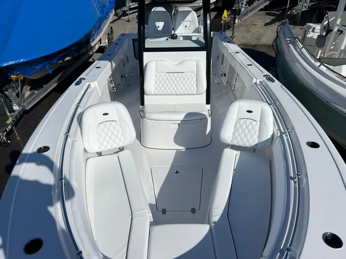  Yacht Photos Pics 2025 Sportsman Open 262 Center Console boat with white seating and sleek design.