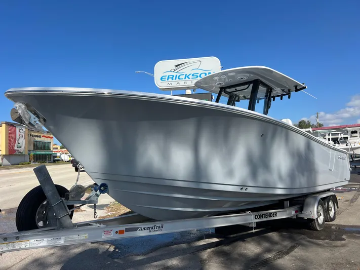  Yacht Photos Pics 2025 Sportsman Open 262 Center Console boat on trailer under clear blue sky.