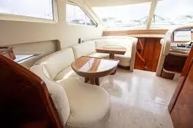  Yacht Photos Pics Luxurious interior of 2003 Azimut 74 Solar yacht with elegant seating and wooden accents.
