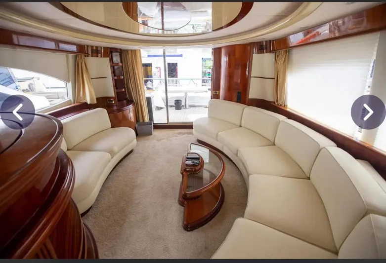 Yacht Photos Pics Luxurious interior of 2003 Azimut 74 Solar yacht with elegant cream seating and wood accents.
