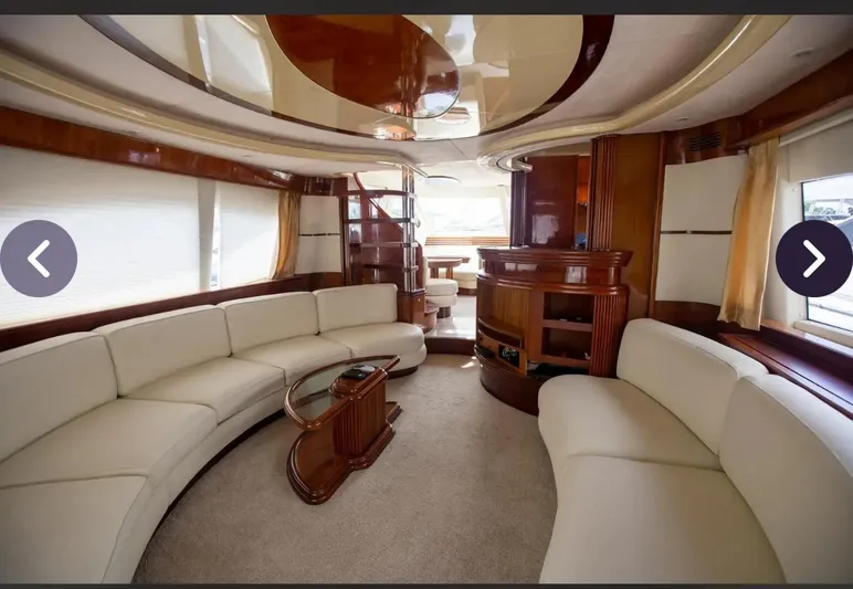  Yacht Photos Pics Luxurious interior of a 2003 Azimut 74 Solar yacht with elegant seating and wood accents.