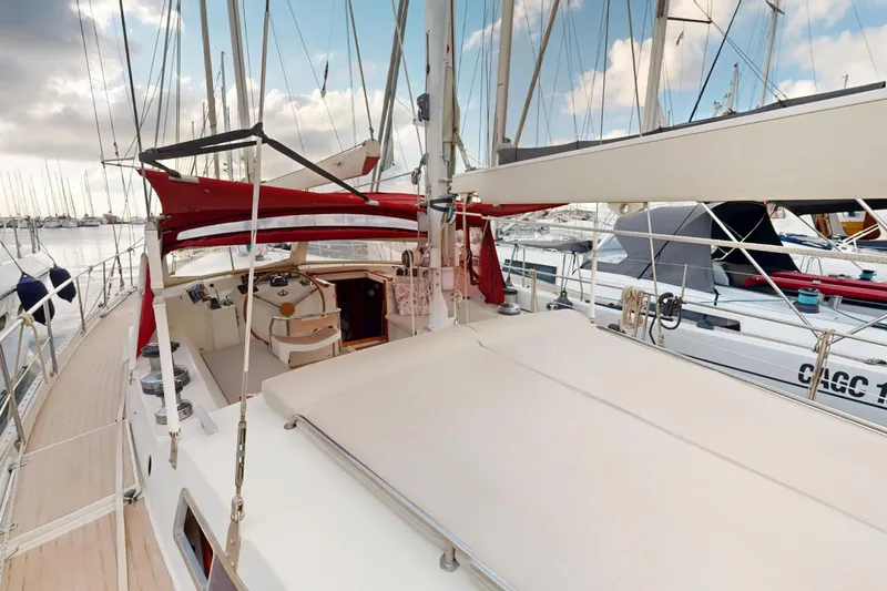  Yacht Photos Pics Sailing yacht Amel Super Maramu 1991, featuring spacious deck and cockpit, docked at marina.