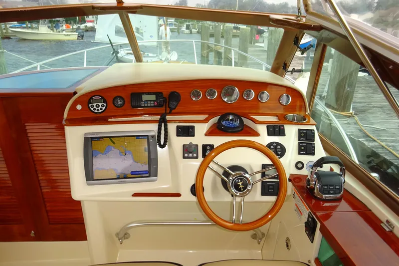 Meandher Yacht Photos Pics 2009 Hunt Yachts Harrier 29 helm with GPS, gauges, and wooden steering wheel.