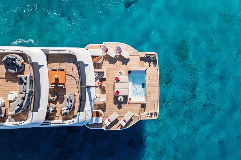 Contigo Yacht Photos Pics Aerial view of 2024 Benetti Oasis 40M yacht with luxurious deck and turquoise water.