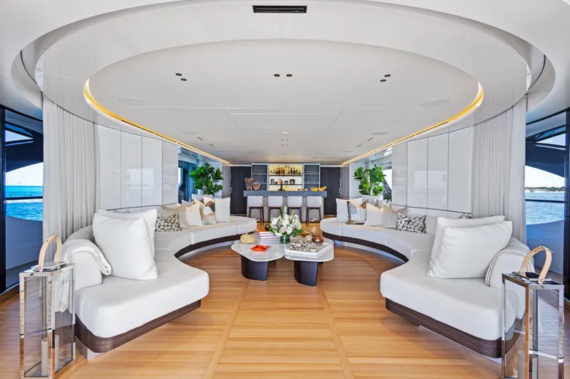 Contigo Yacht Photos Pics Luxurious interior of 2024 Benetti Oasis 40M yacht with elegant seating and modern decor.