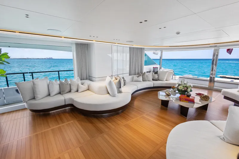 Contigo Yacht Photos Pics Luxurious interior of 2024 Benetti Oasis 40M yacht with ocean view and elegant seating.