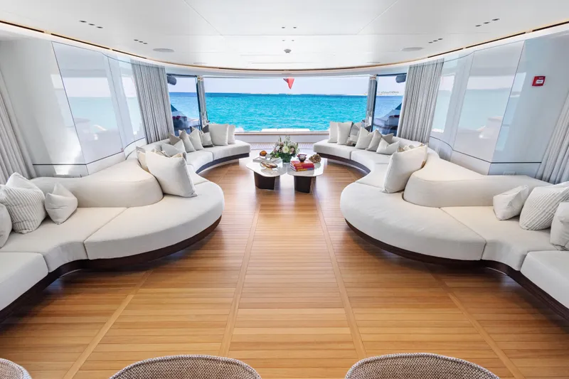 Contigo Yacht Photos Pics Luxurious interior of 2024 Benetti Oasis 40M yacht with ocean view and elegant seating.