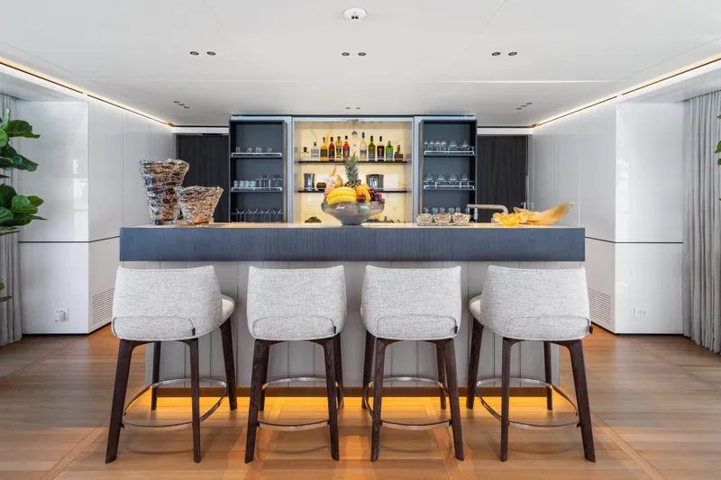 Contigo Yacht Photos Pics Luxurious bar area on 2024 Benetti Oasis 40M yacht with elegant seating and modern decor.