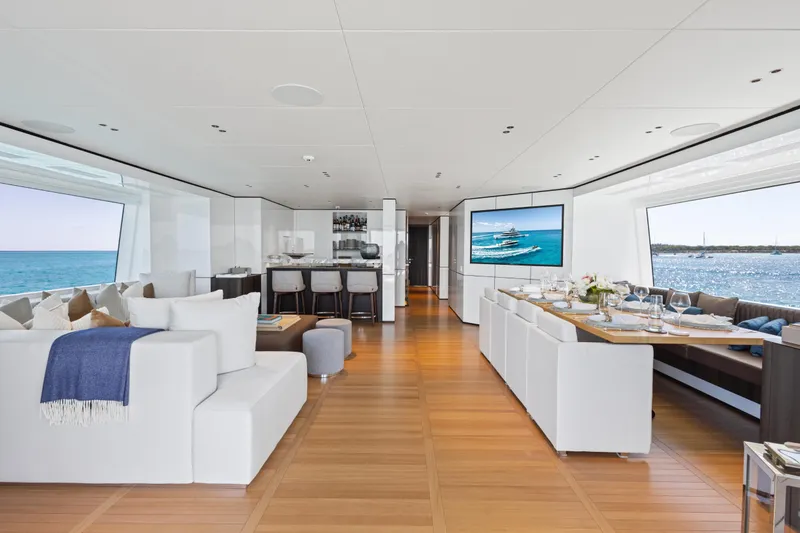 Contigo Yacht Photos Pics Luxurious interior of 2024 Benetti Oasis 40M yacht with elegant dining and lounge area.