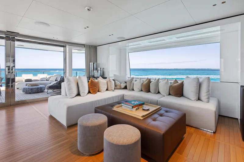 Contigo Yacht Photos Pics Luxurious interior of 2024 Benetti Oasis 40M yacht with ocean view and modern seating.