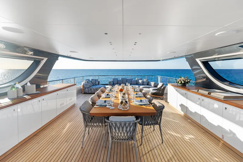 Contigo Yacht Photos Pics Luxurious dining area on 2024 Benetti Oasis 40M yacht with ocean view.