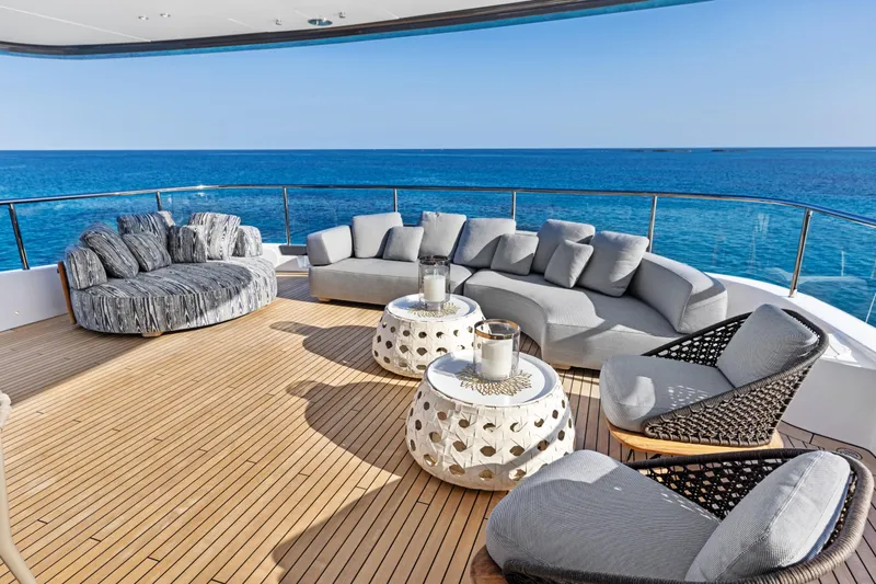 Contigo Yacht Photos Pics Luxurious deck of 2024 Benetti Oasis 40M yacht with elegant seating and ocean view.