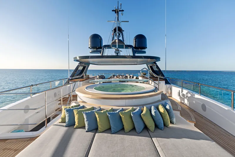 Contigo Yacht Photos Pics Luxurious 2024 Benetti Oasis 40M yacht deck with jacuzzi and ocean view.