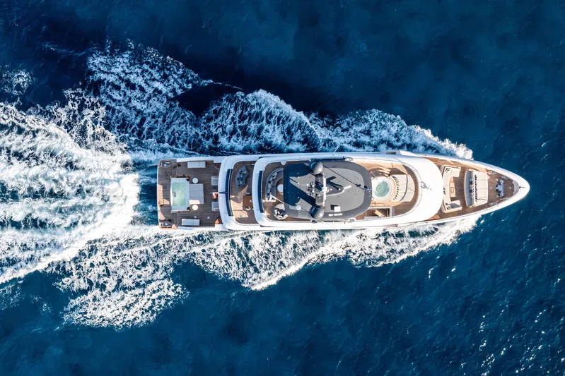 Contigo Yacht Photos Pics Aerial view of 2024 Benetti Oasis 40M yacht cruising on blue ocean waters.