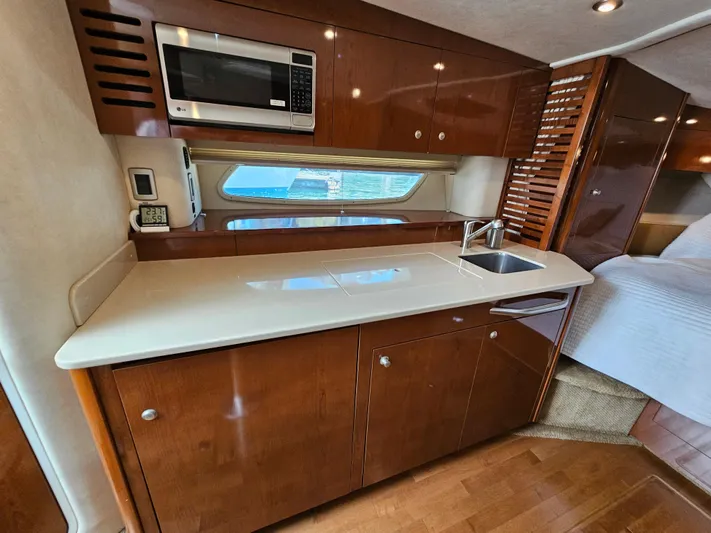 Ula Yacht Photos Pics Interior of 2009 Sea Ray 350 Sundancer with kitchenette.