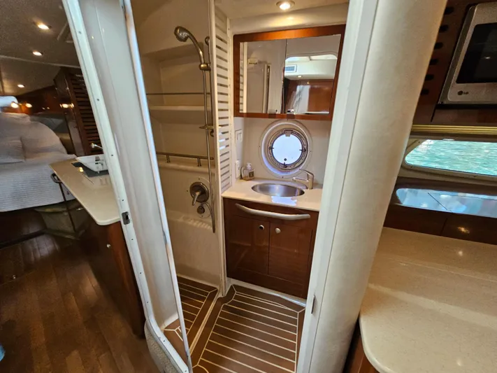 Ula Yacht Photos Pics Interior of 2009 Sea Ray 350 Sundancer with bathroom and kitchenette.