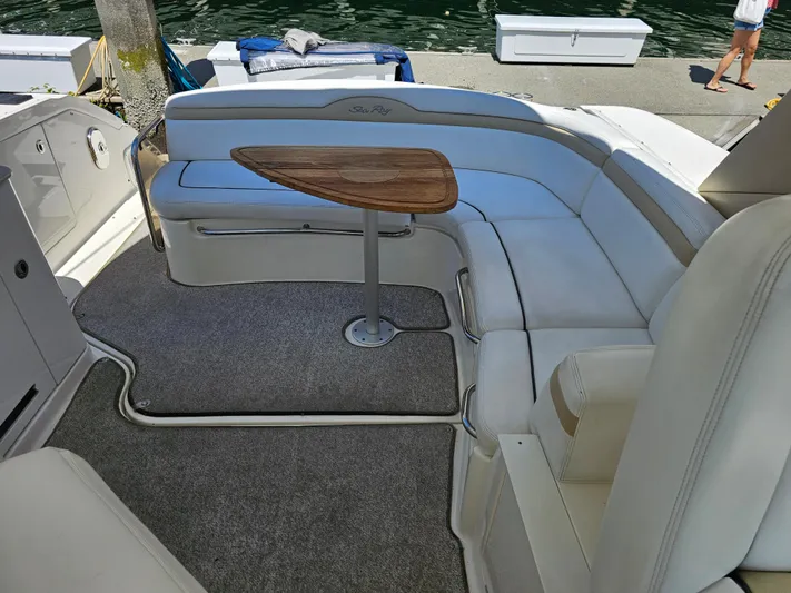Ula Yacht Photos Pics Interior of 2009 Sea Ray 350 Sundancer with seating area and table.