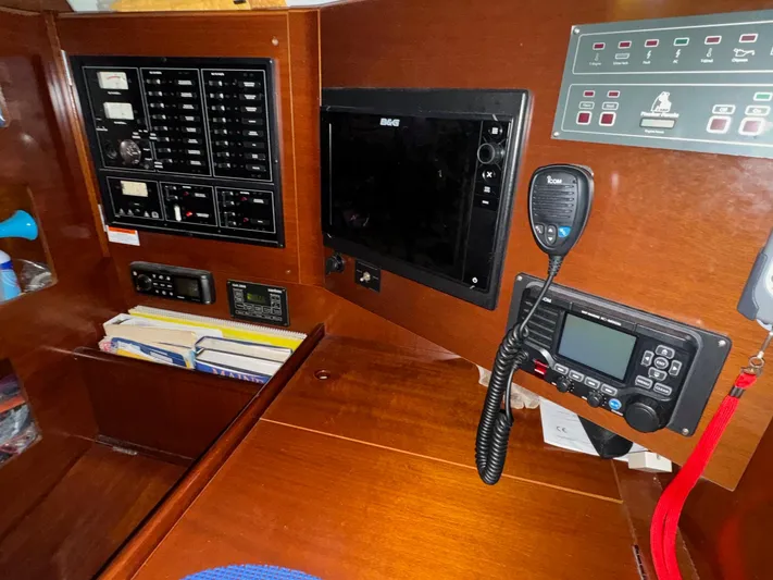 Kaleidoscope Yacht Photos Pics Navigation and control panel inside a 2004 Beneteau First 47.7 sailboat.