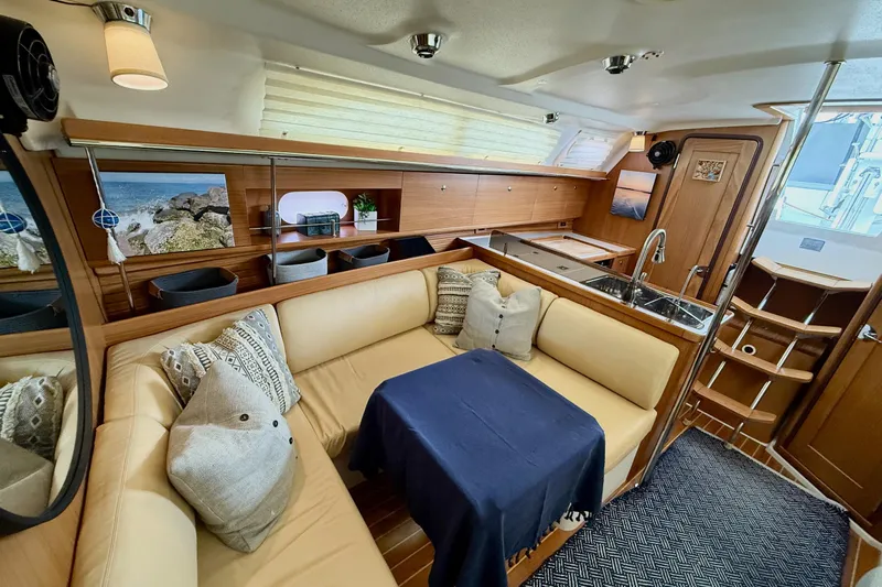Magic Yacht Photos Pics Luxurious interior of 2011 Catalina 355 yacht with cozy seating and modern kitchen.