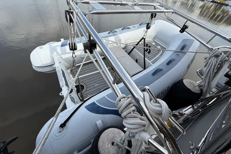 Magic Yacht Photos Pics Inflatable boat secured on a 2011 Catalina 355 yacht, docked on calm water.