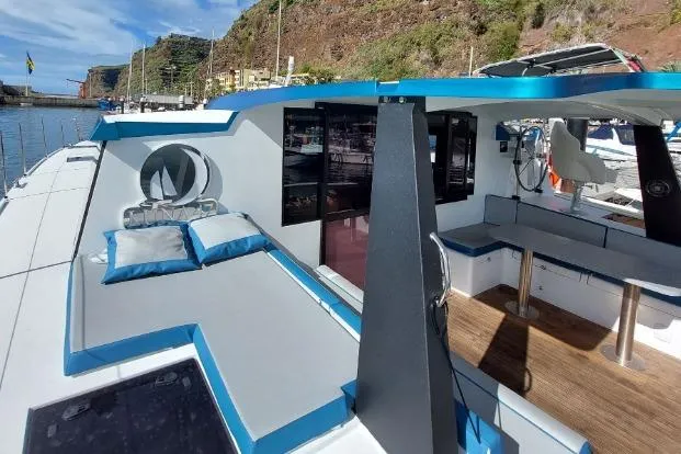  Yacht Photos Pics Modern Luna 47 yacht, 2023 model, featuring spacious deck and comfortable seating in a scenic marina.