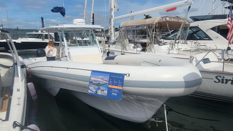  Yacht Photos Pics 2022 Sea Blade 36 R boat docked at marina, surrounded by other boats.