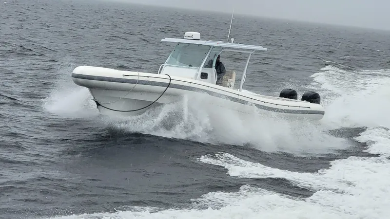  Yacht Photos Pics 2022 Sea Blade 36 R boat cruising on open water.