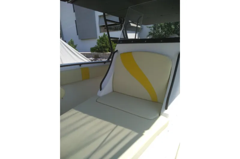 4play Yacht Photos Pics 2013 Fountain 38 Sportfish CC Open Bow interior with yellow-accented seating.