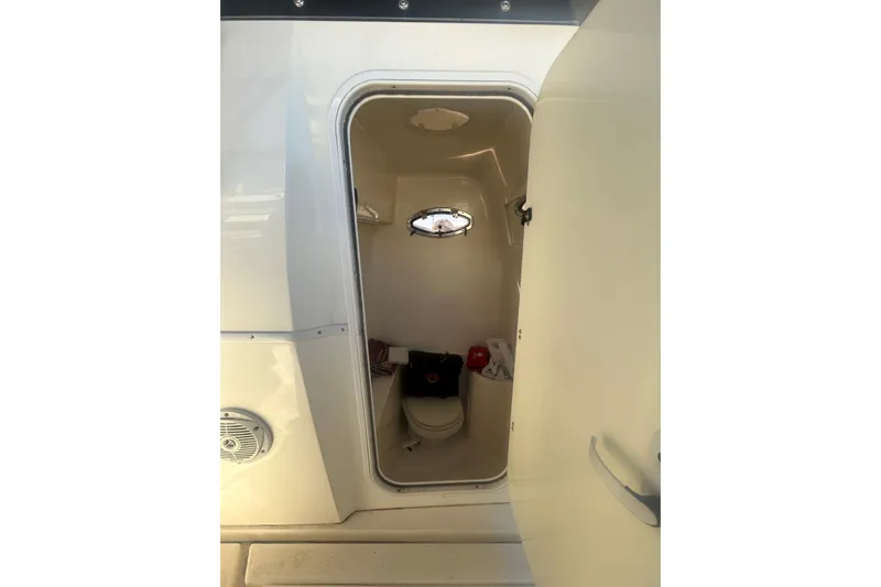 4play Yacht Photos Pics 2013 Fountain 38 Sportfish CC Open Bow boat interior with compact restroom.