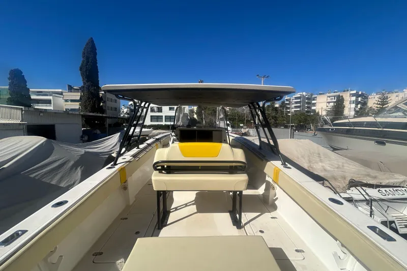 4play Yacht Photos Pics 2013 Fountain 38 Sportfish CC Open Bow boat in urban marina setting.