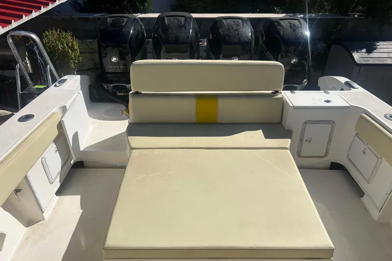 4play Yacht Photos Pics 2013 Fountain 38 Sportfish CC Open Bow with cushioned seating and multiple outboard engines.