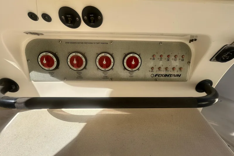 4play Yacht Photos Pics Control panel of 2013 Fountain 38 Sportfish CC Open Bow boat with switches and dials.