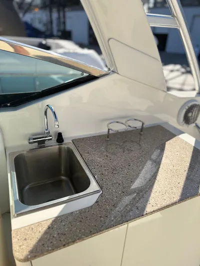  Yacht Photos Pics 2014 Sea Ray 300 SLX boat kitchenette with sink and countertop.