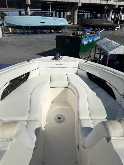  Yacht Photos Pics 2014 Sea Ray 300 SLX boat with white seating, docked near other vessels.