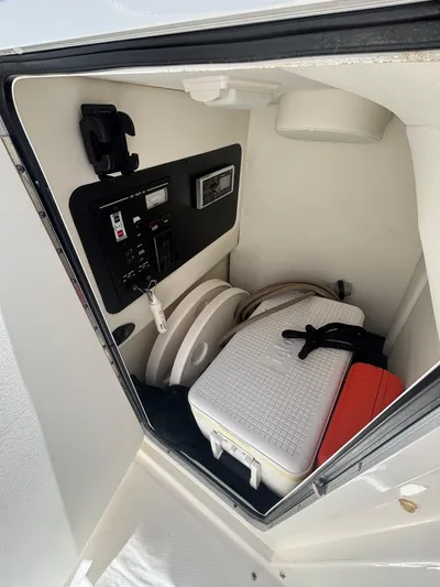  Yacht Photos Pics Interior storage compartment of 2014 Sea Ray 300 SLX boat with cooler and equipment.